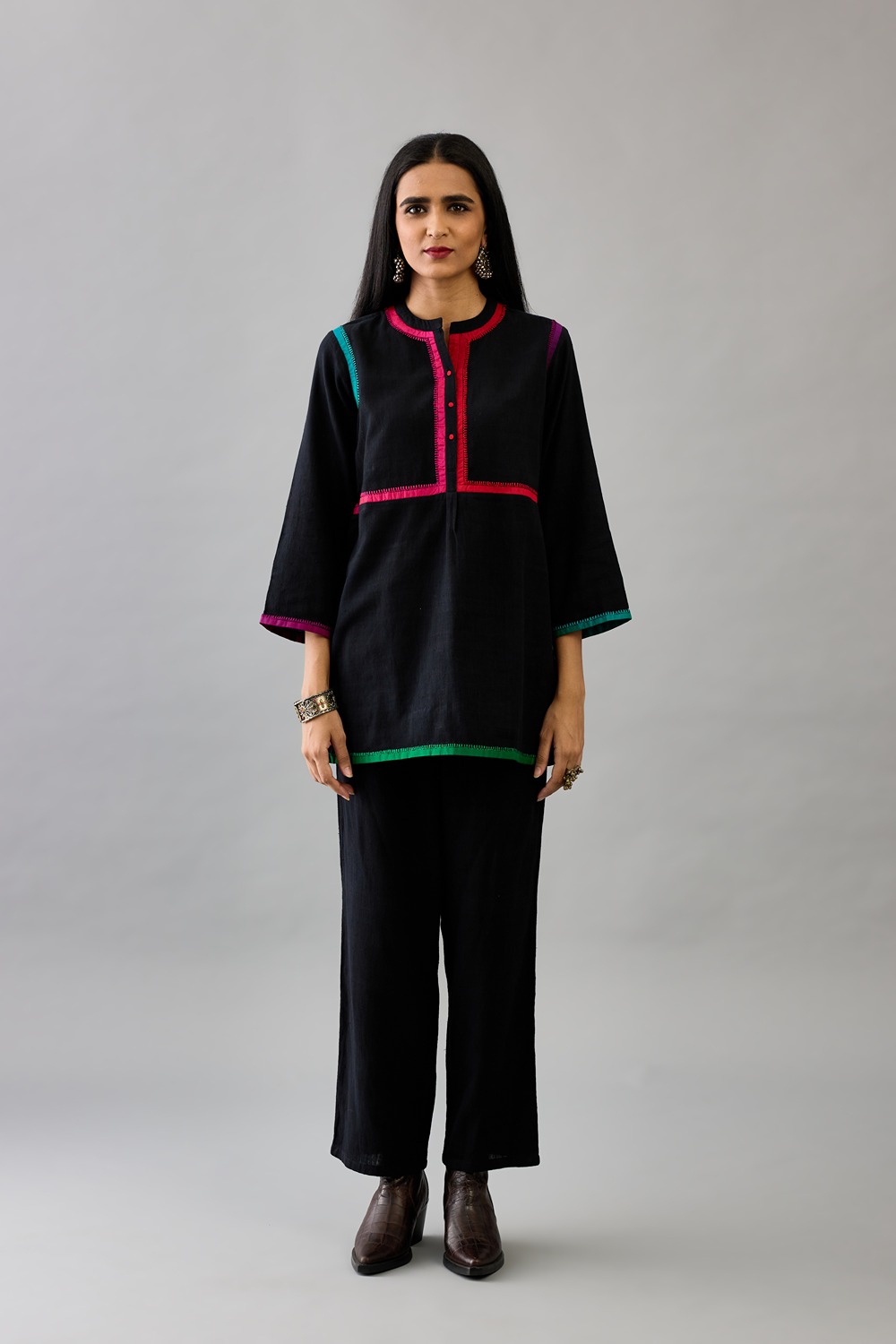 Black handloom cotton short top paired with black handloom cotton straight pants 