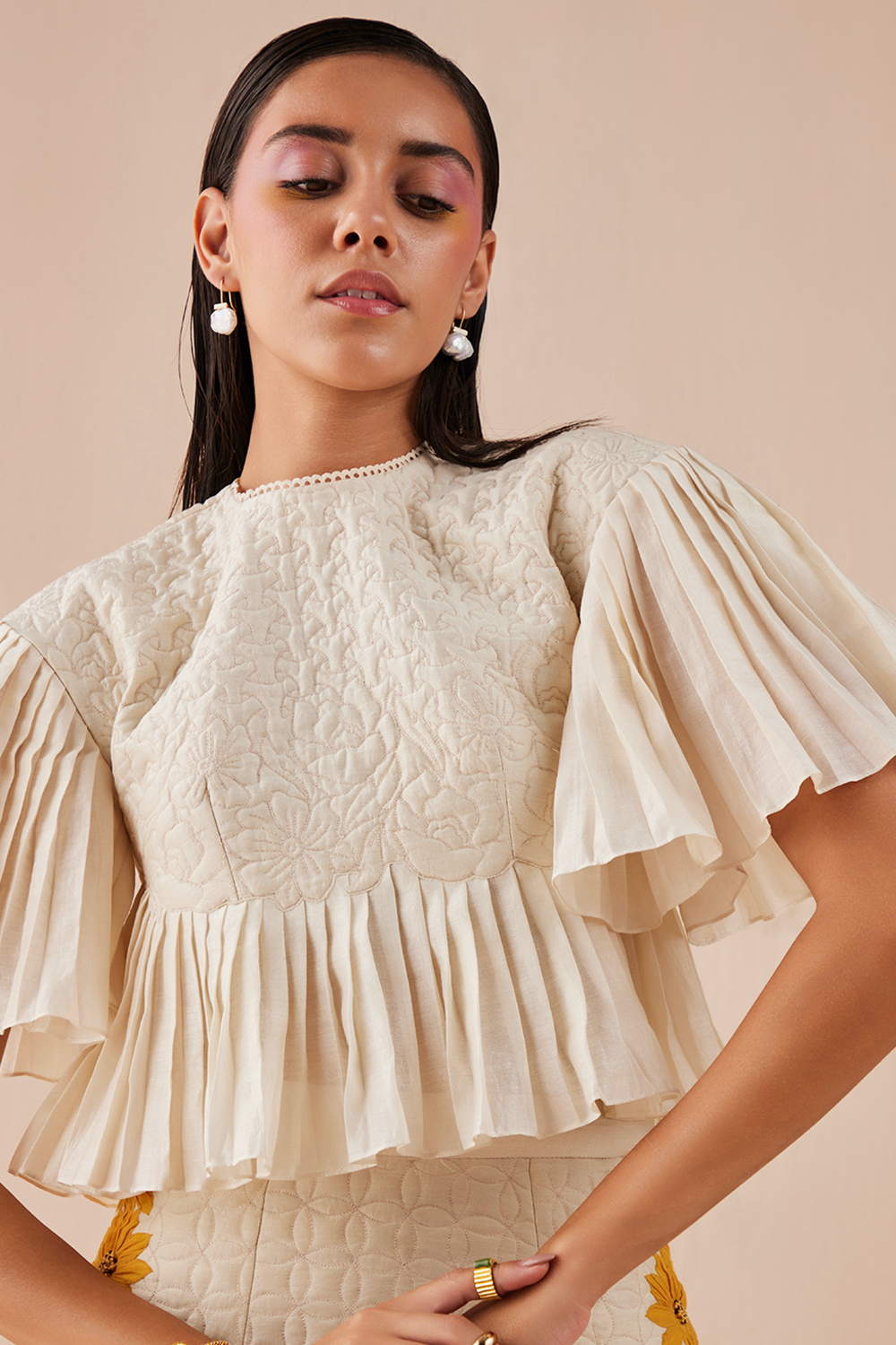 Ivory Quilted And Pleated Top