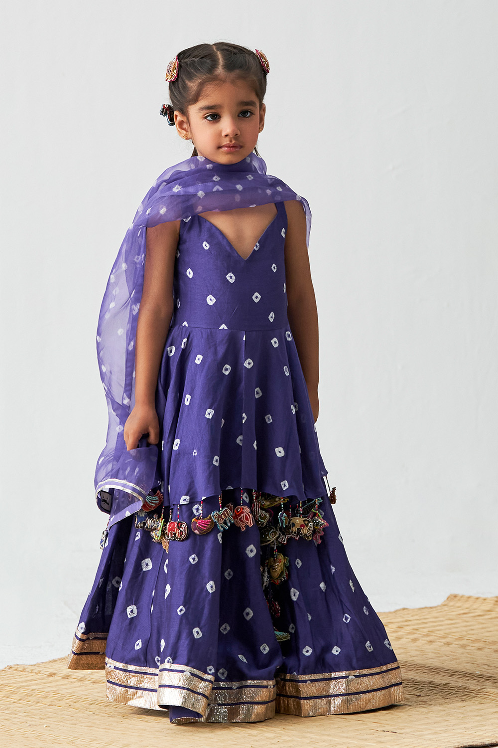 Blue Bandhani Tunic Edged With Animals Tassels Further Paired With Lehenga And Organza Dupatta