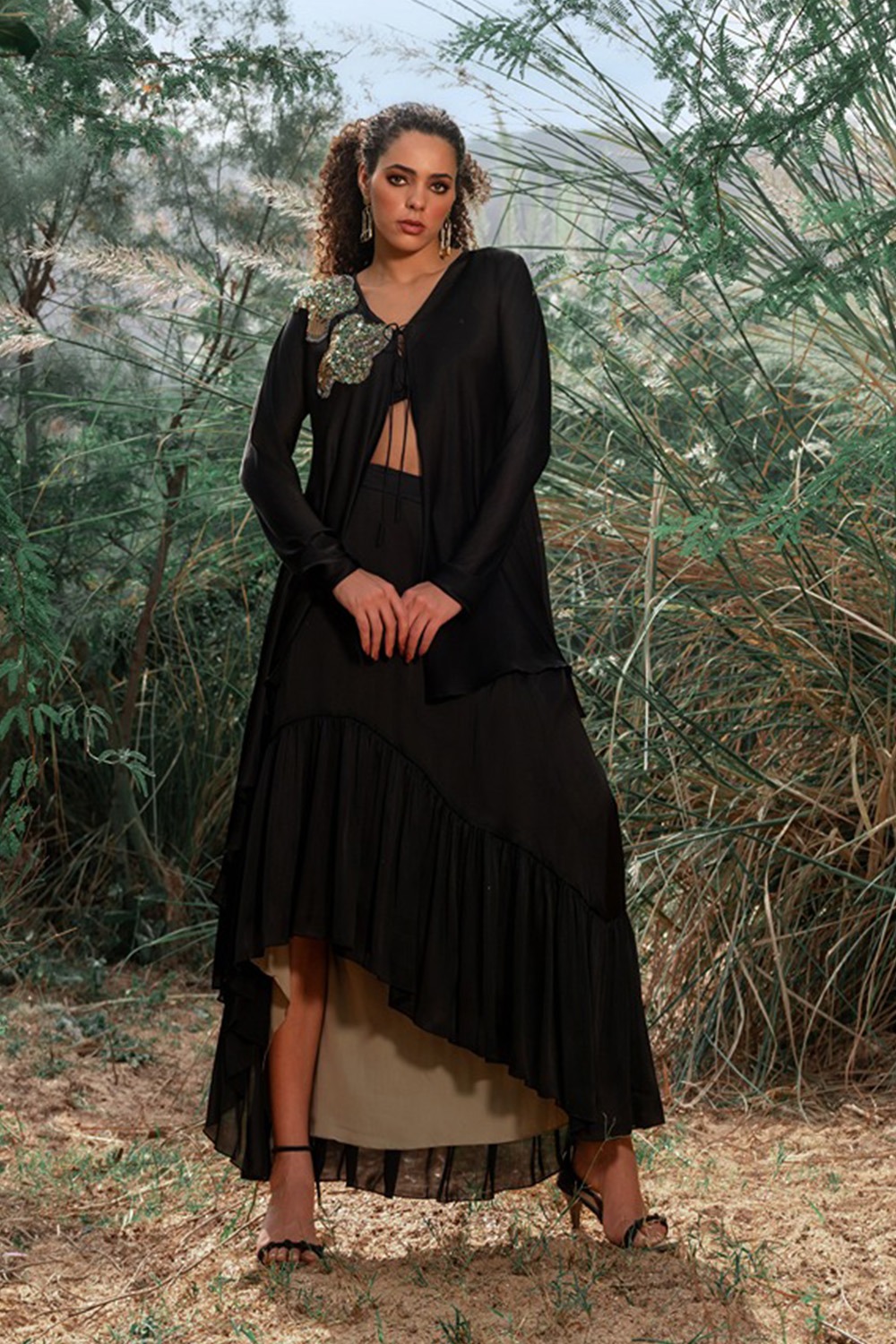 Frilled Skirt Paired With Black Bustier And High And Low Shrug