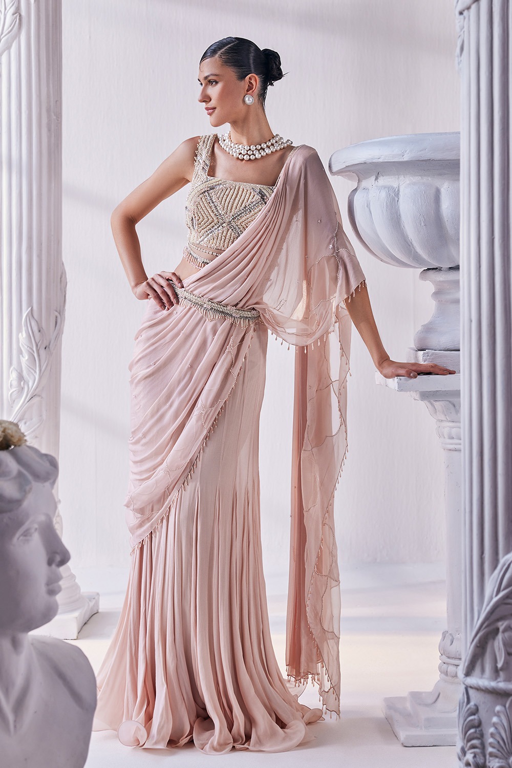 Peach Chiffon Drape Saree With a Heavy Emroidered Blouse And a Belt