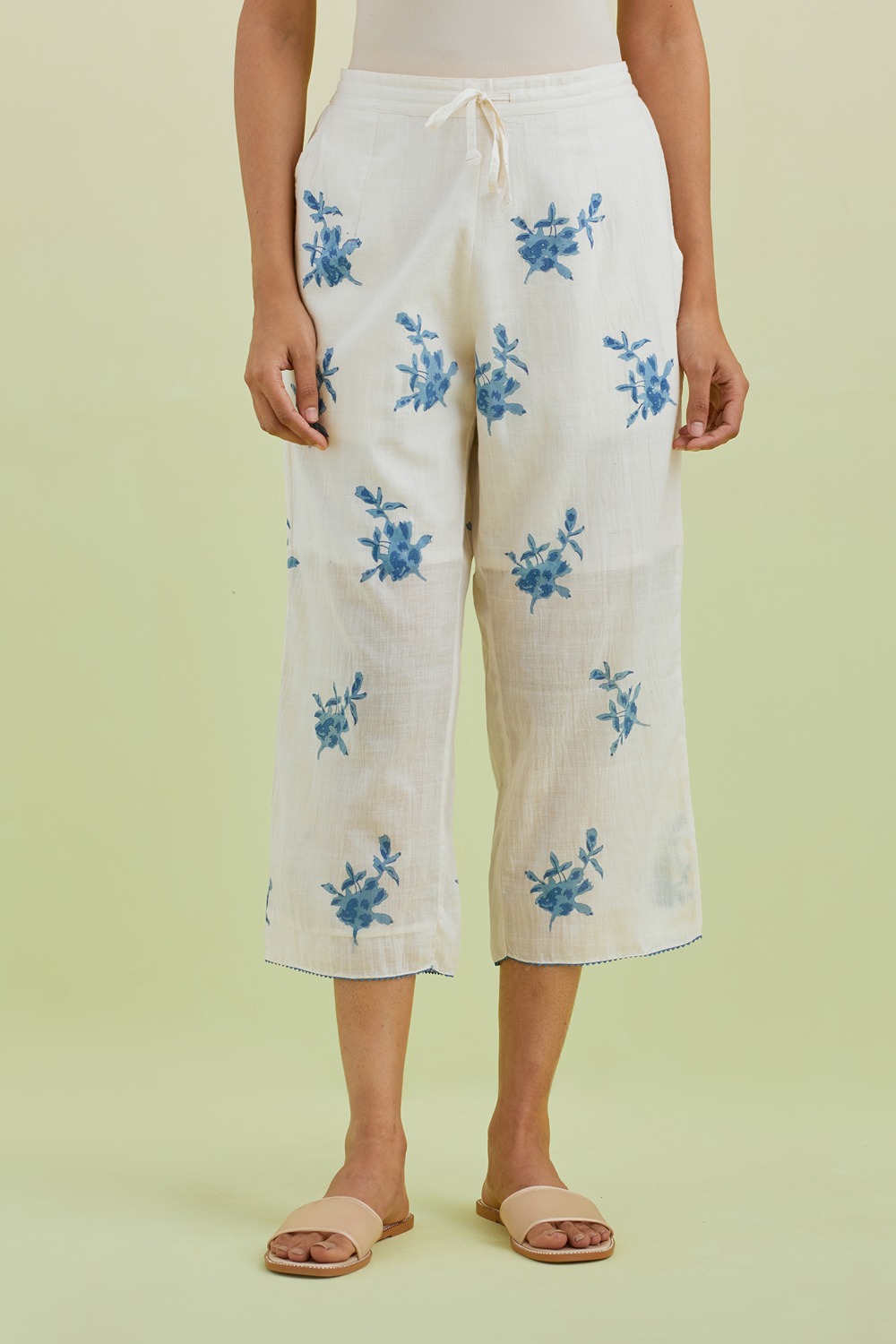 Off White Straight Ankle Length Pants With All-Over Blue Colored Floral Boota Hand-Block Print
