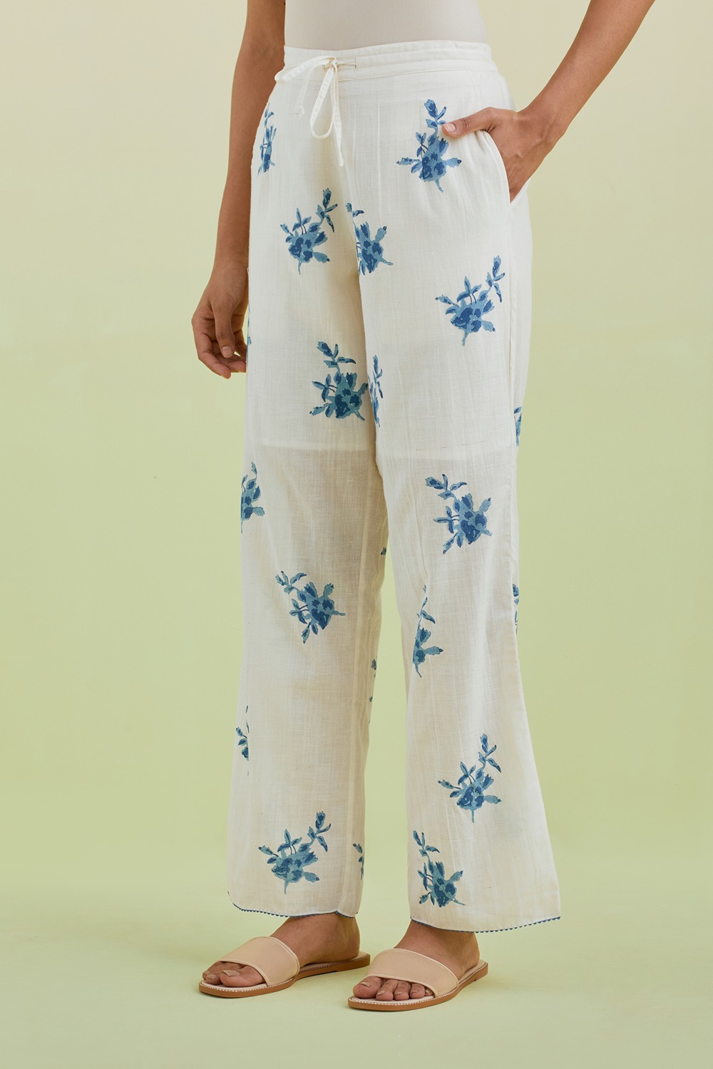 Off White Straight Pants With All-Over Blue Colored Floral Boota Hand-Block Print