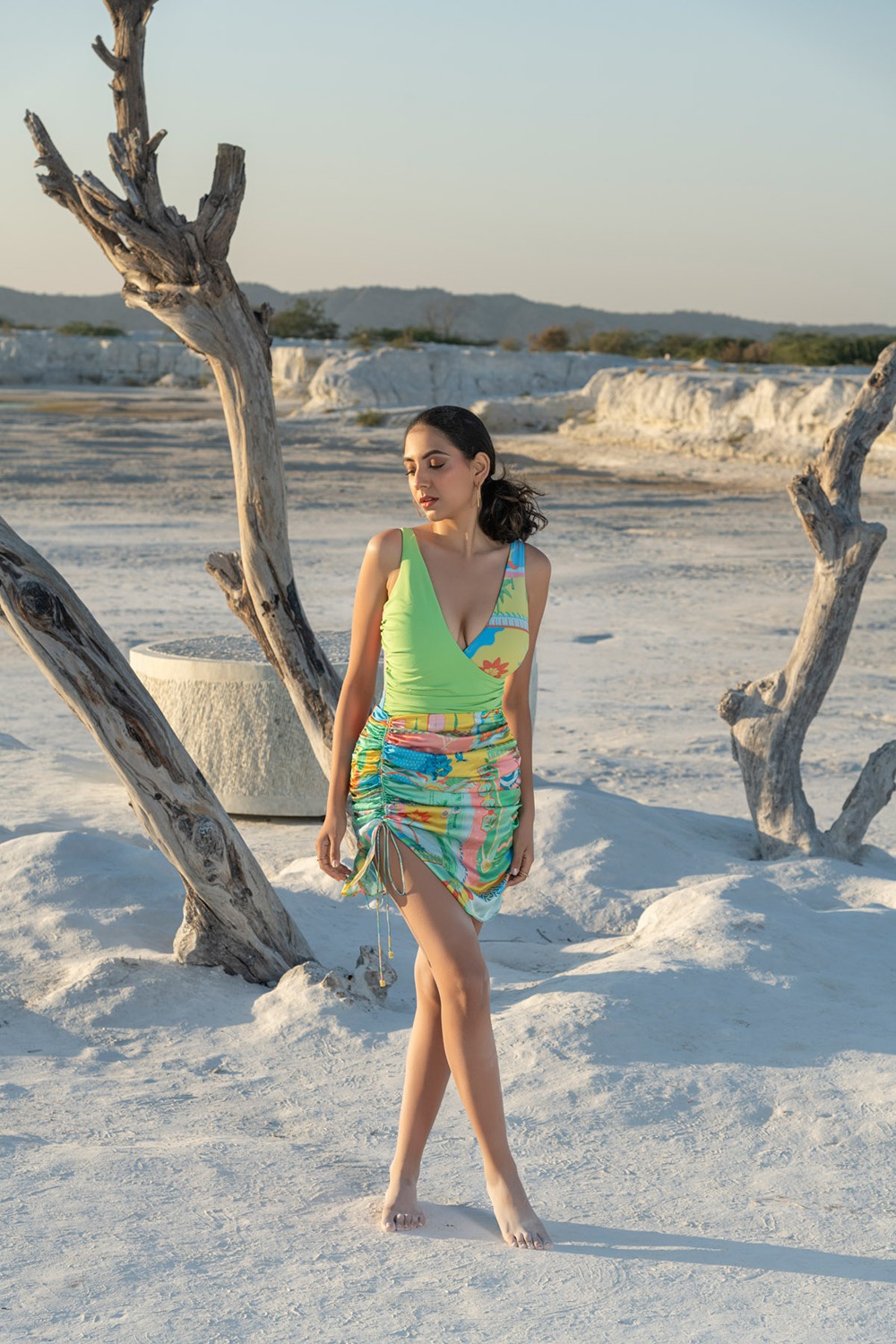 Crossover Swimsuit Paired With Little Cinched Skirt In Cuba